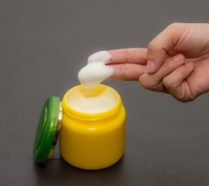 lotion in yellow jar