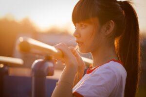 girl looking at sunset